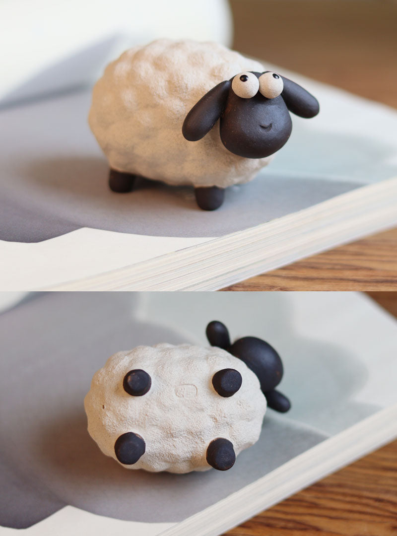 "A pair of cute little sheep" sculpture