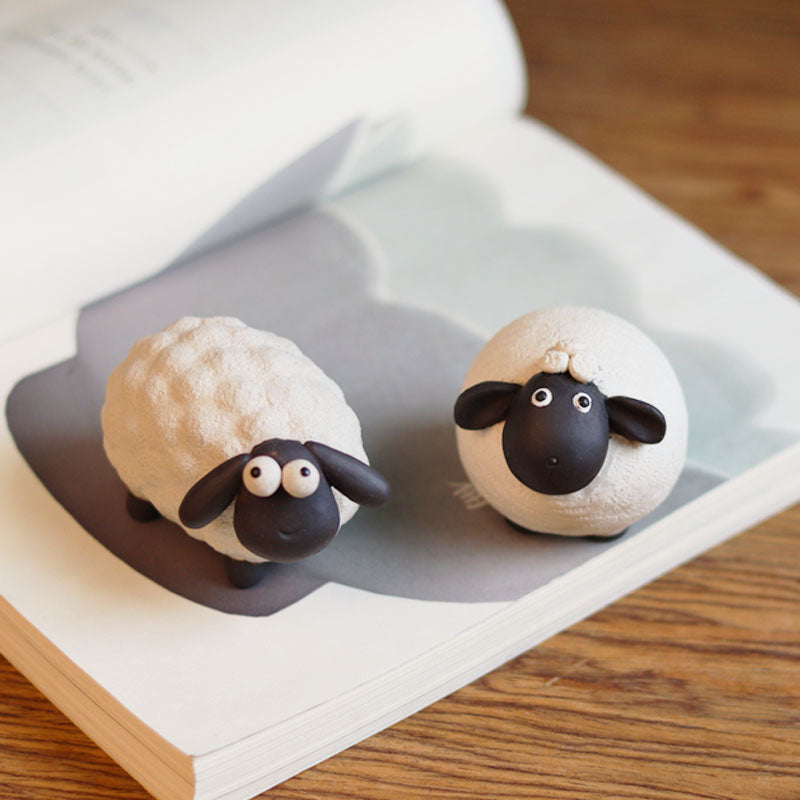 "A pair of cute little sheep" sculpture