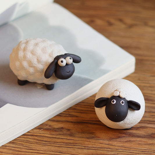 "A pair of cute little sheep" sculpture